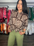 Top button Marcela